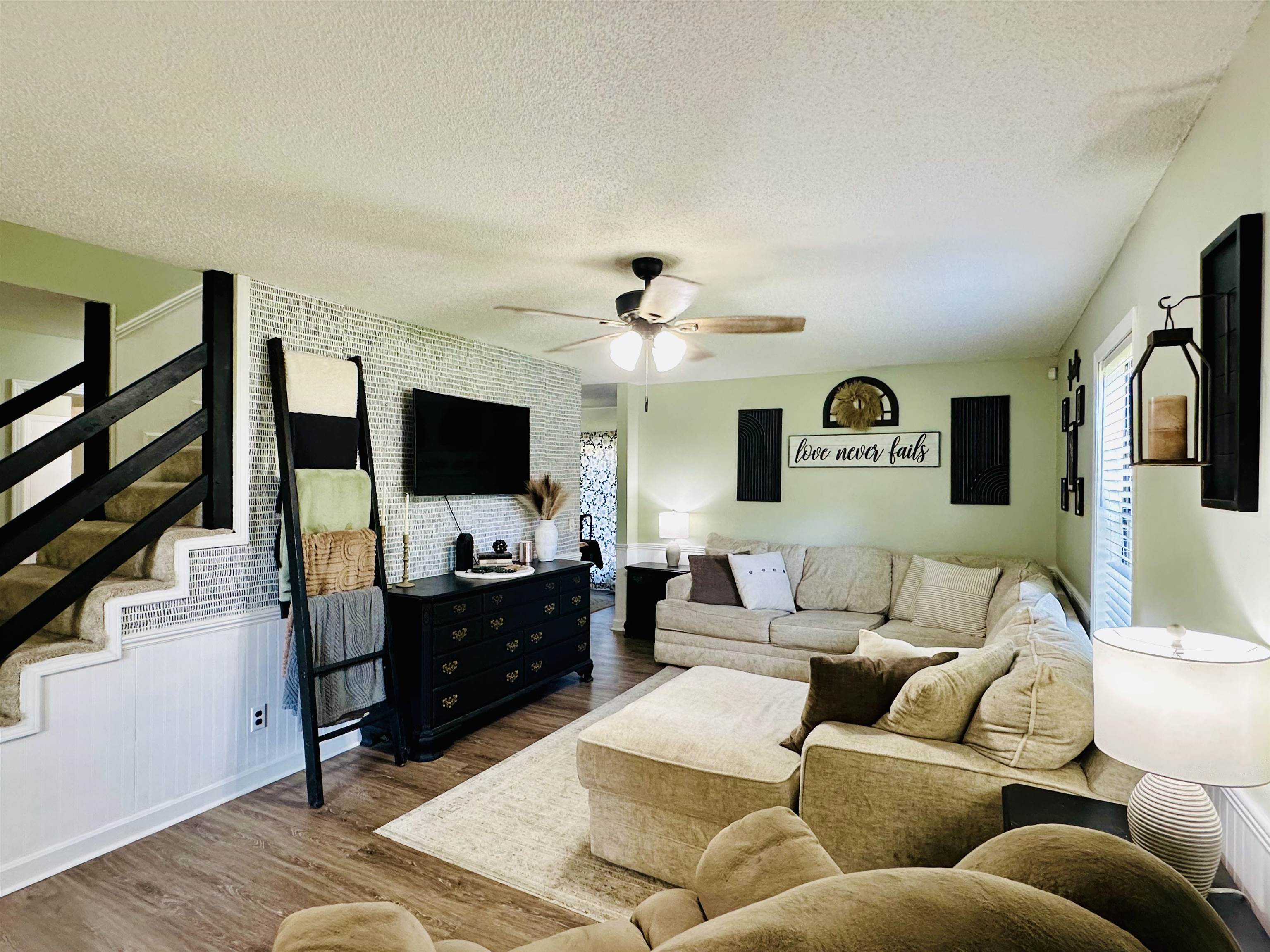 7120 Powell Chapel Road Hornsby, TN 38044 - Photo 3 of 29 a living room with furniture and a flat screen tv