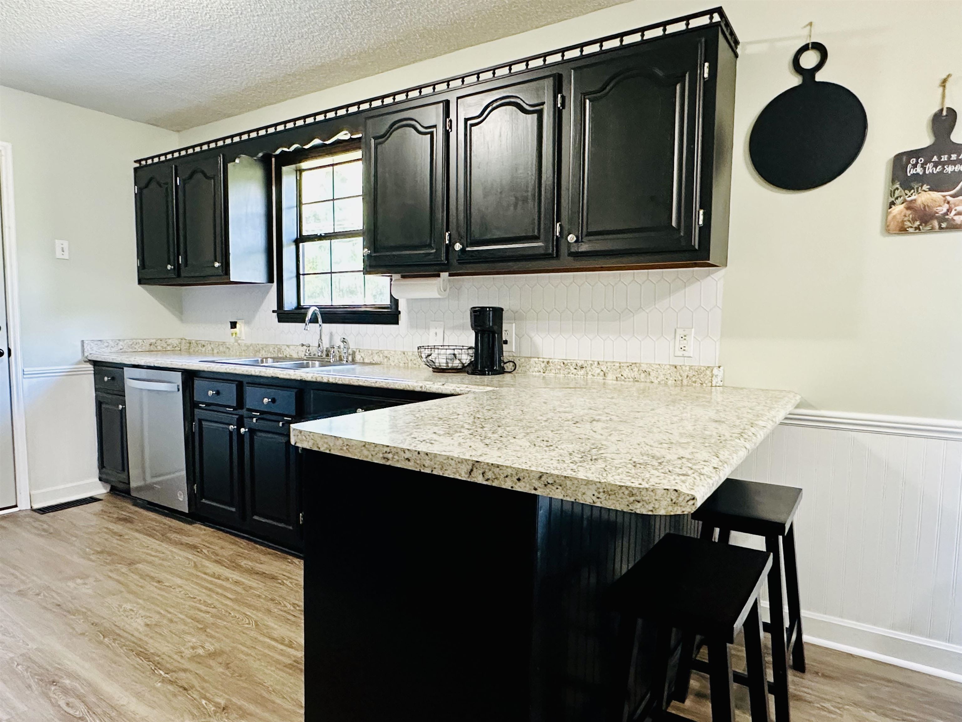 7120 Powell Chapel Road Hornsby, TN 38044 - Photo 7 of 29 a bathroom with a granite countertop sink and a mirror
