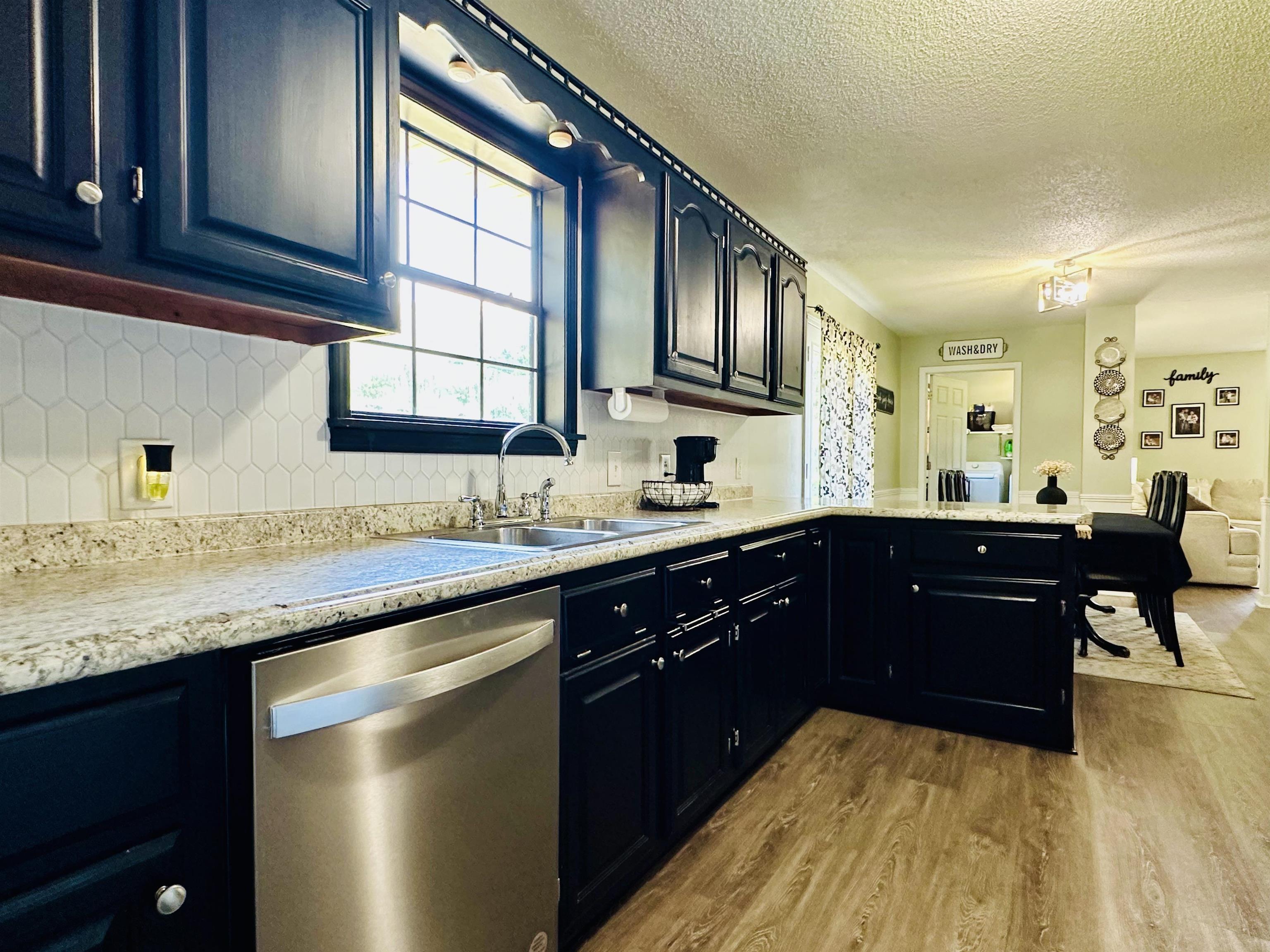 7120 Powell Chapel Road Hornsby, TN 38044 - Photo 8 of 29 a kitchen with a sink and cabinets
