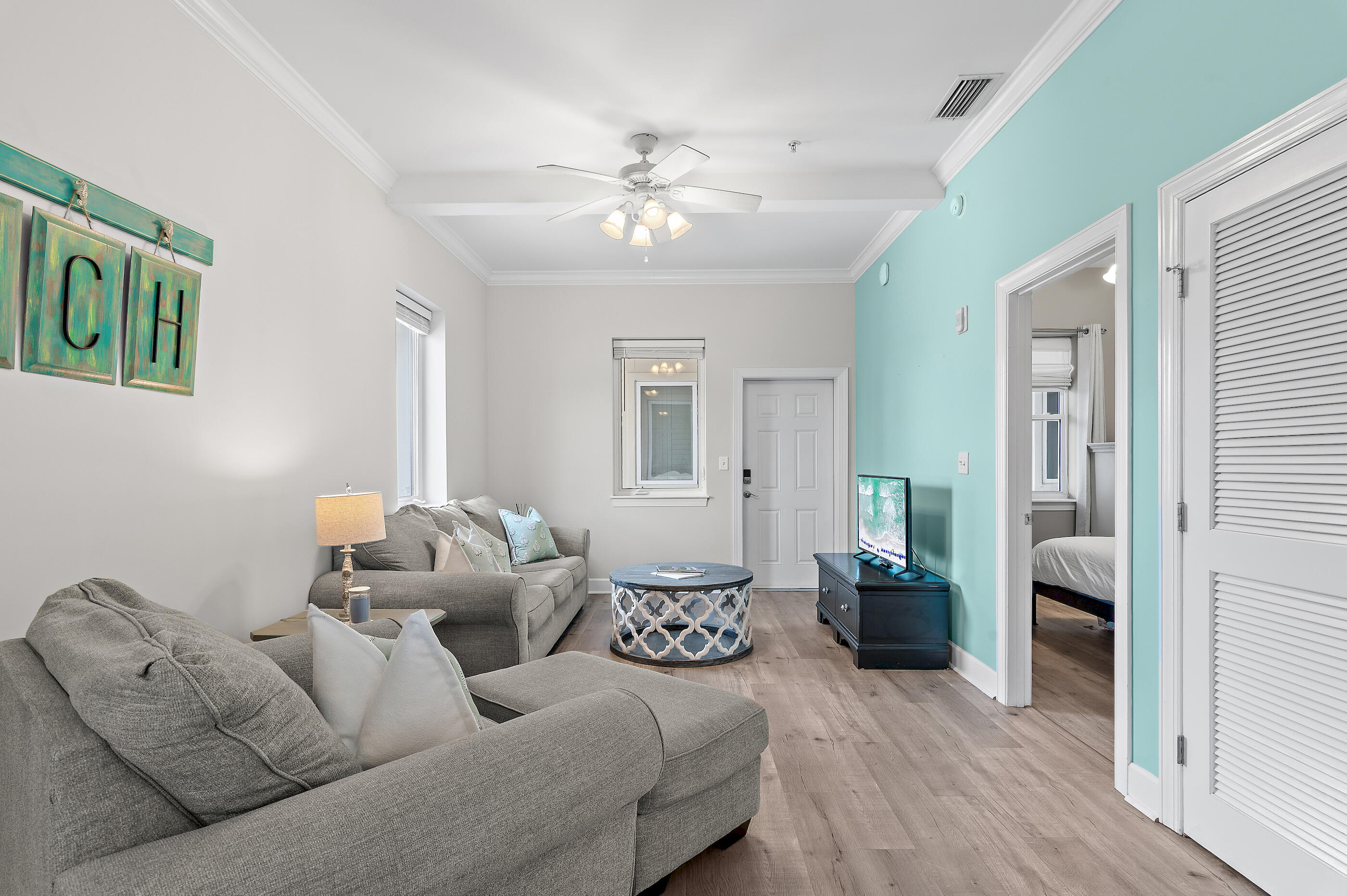 231 Somerset Bridge Road, Unit 2109 Santa Rosa Beach, FL 32459 - Photo 3 of 31 a living room with furniture and a chandelier
