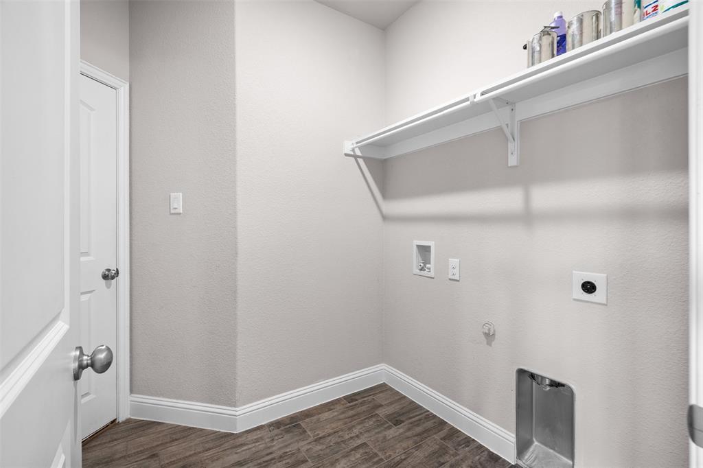 119 Happy Lane Red Oak, TX 75154 - Photo 16 of 37 Dedicated utility space featuring wood-look tile flooring, white baseboards, and light gray walls
