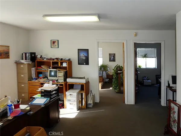 a view of a workspace with furniture
