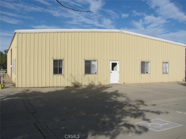 a view of an empty room with windows