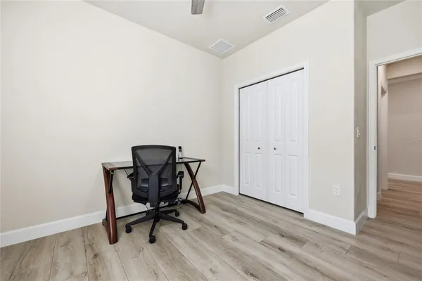 a work place with a chair and a window