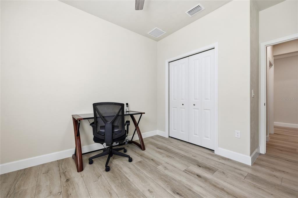 1402 Southwest 67th Drive Gainesville, FL 32607 - Photo 20 of 30 a work place with a chair and a window