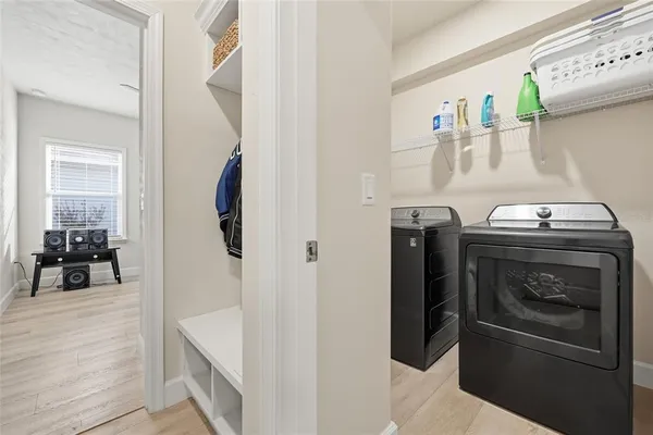 a kitchen with a refrigerator and washer