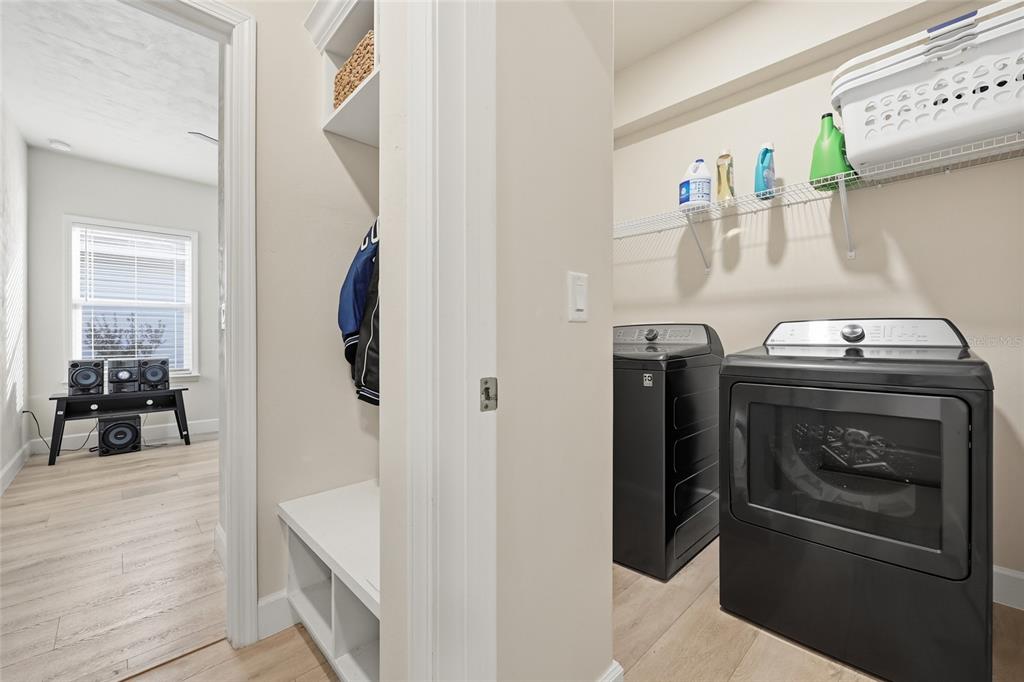 1402 Southwest 67th Drive Gainesville, FL 32607 - Photo 21 of 30 a kitchen with a refrigerator and washer