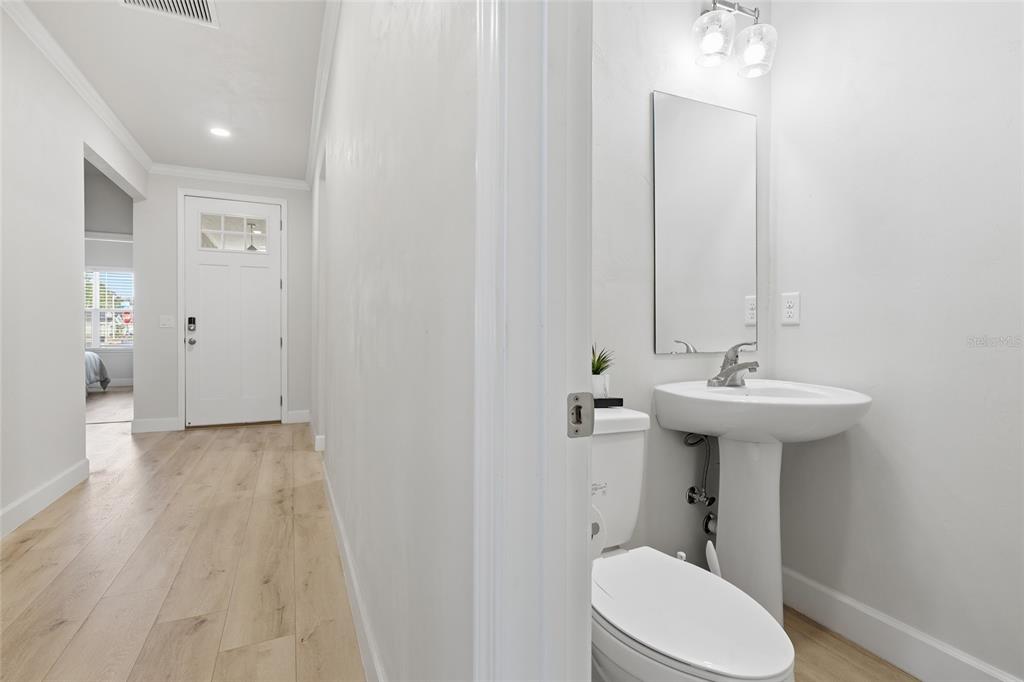 1402 Southwest 67th Drive Gainesville, FL 32607 - Photo 22 of 30 a bathroom with a sink a toilet and shower