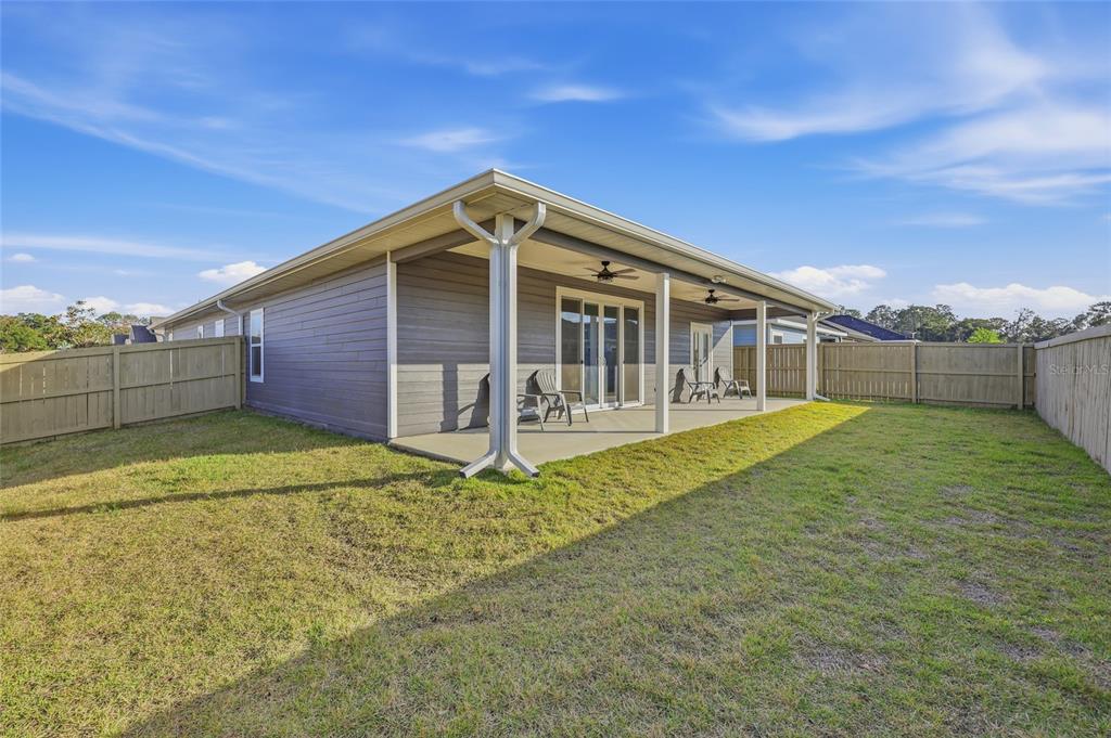 1402 Southwest 67th Drive Gainesville, FL 32607 - Photo 24 of 30 a view of a house with a backyard