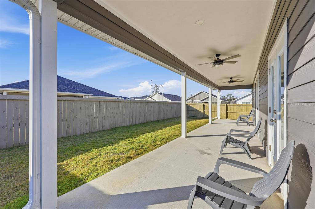 1402 Southwest 67th Drive Gainesville, FL 32607 - Photo 27 of 30 a view of a porch with furniture and a yard