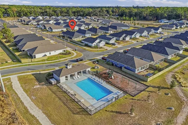 an aerial view of a house with a ocean view