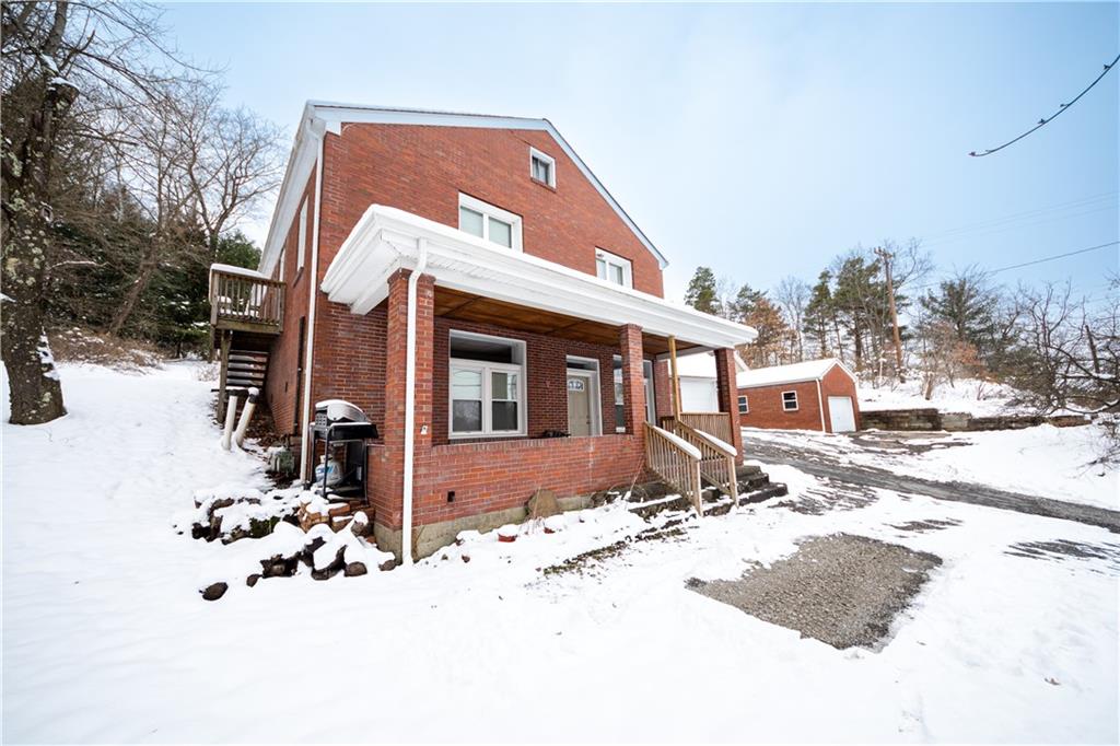 177 Bryson Road Gibsonia, PA 15044 - Photo 1 of 17 a view of a house with snow on the road