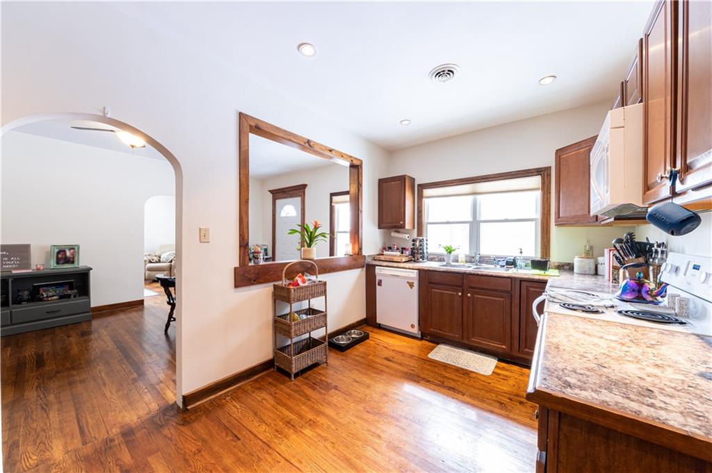 177 Bryson Road Gibsonia, PA 15044 - Photo 5 of 17 a large white kitchen with sink refrigerator and window