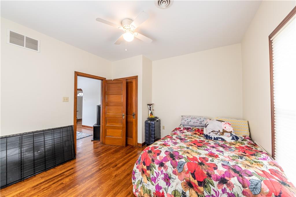 177 Bryson Road Gibsonia, PA 15044 - Photo 9 of 17 a bedroom with a bed and wooden floor