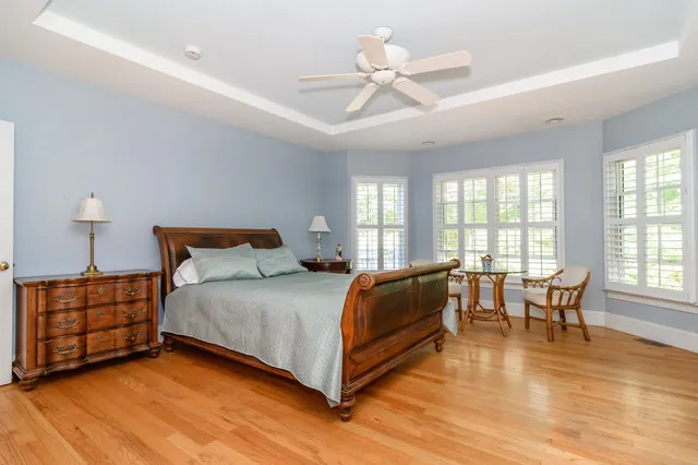 a bed room with a bed and a chair