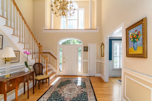 a view of an entryway with wooden floor