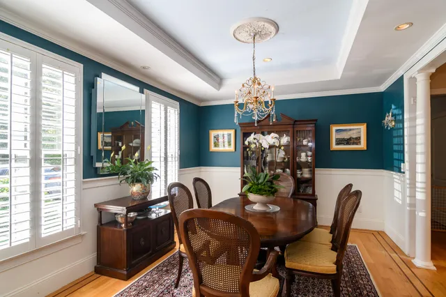 a dining room with furniture a livingroom and chandelier