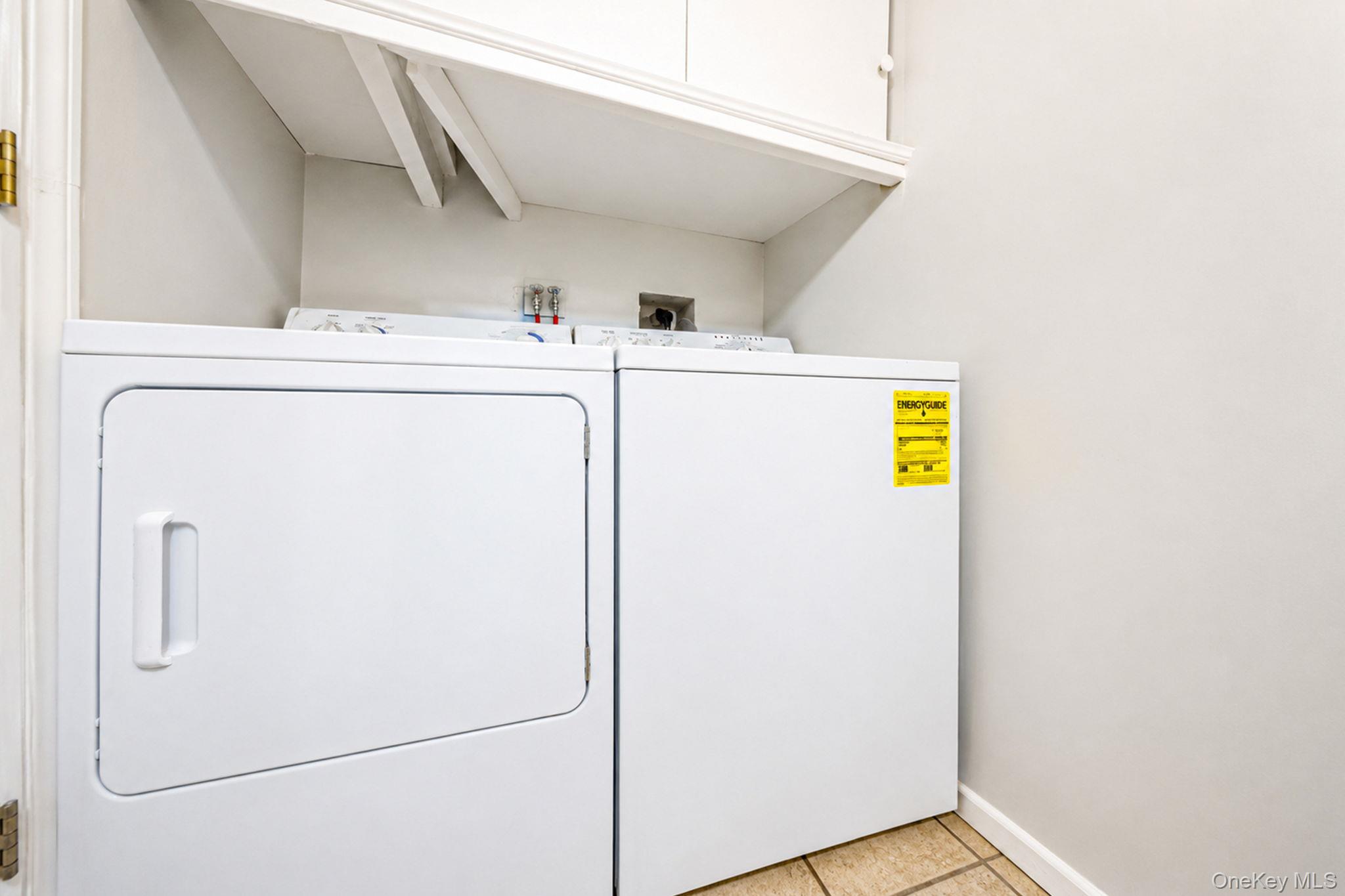 93-20 92nd Avenue Queens, NY 11421 - Photo 17 of 21 a utility room with dryer and washer
