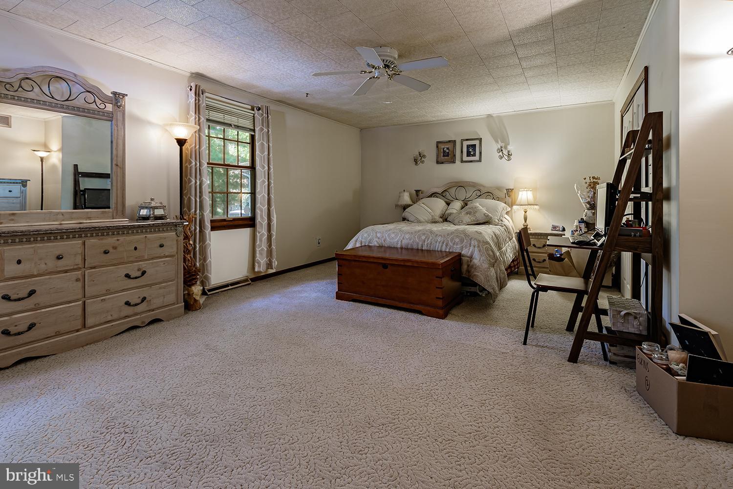 30 Hinchman Road Medford, NJ 08055 - Photo 14 of 30 a spacious bedroom with a bed and a mirror