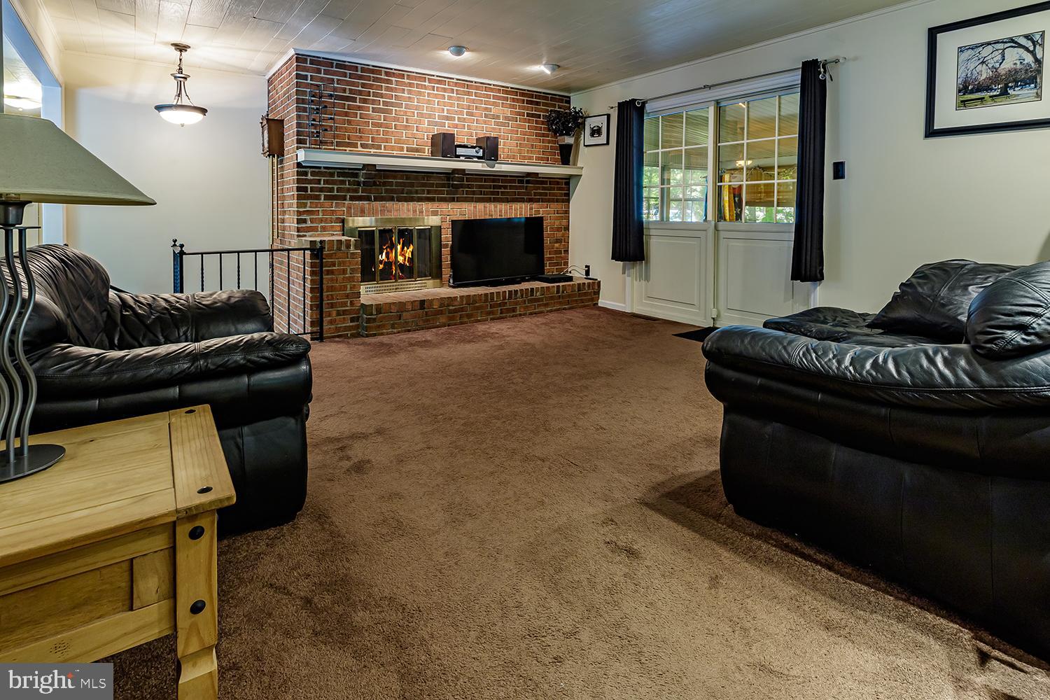 30 Hinchman Road Medford, NJ 08055 - Photo 8 of 30 a living room with furniture and a fireplace