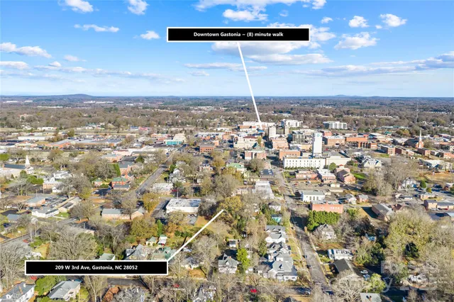 an aerial view of residential building with green space