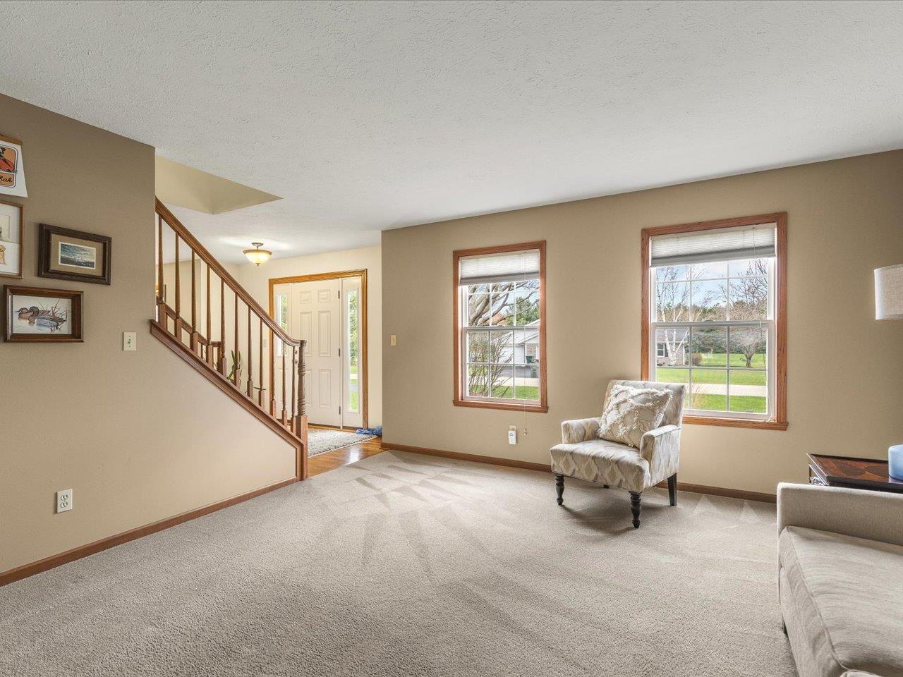 8027 Barclay Road Rockford, IL 61102 - Photo 11 of 67 a living room with furniture and a window