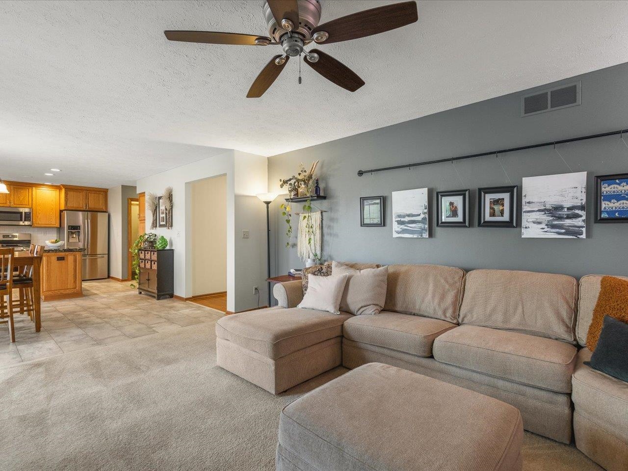 8027 Barclay Road Rockford, IL 61102 - Photo 16 of 67 a living room with furniture and a flat screen tv