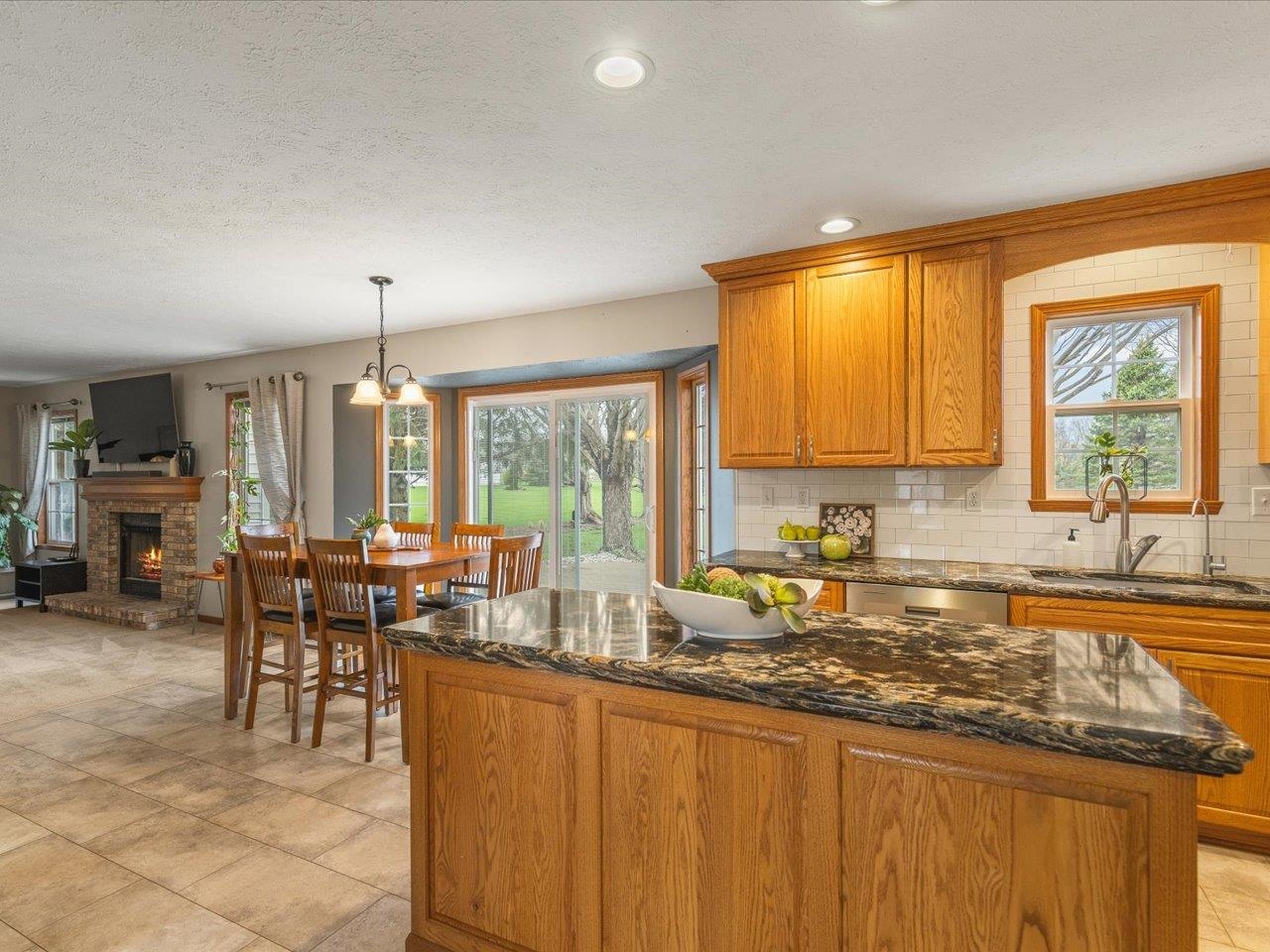 8027 Barclay Road Rockford, IL 61102 - Photo 20 of 67 a kitchen with a large window in it and kitchen island