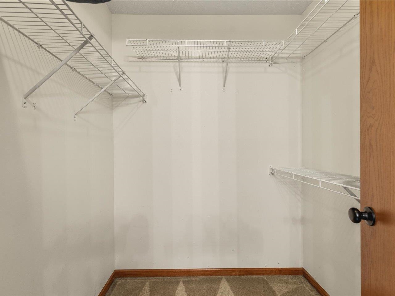 8027 Barclay Road Rockford, IL 61102 - Photo 34 of 67 a view of a room with racks on the wall