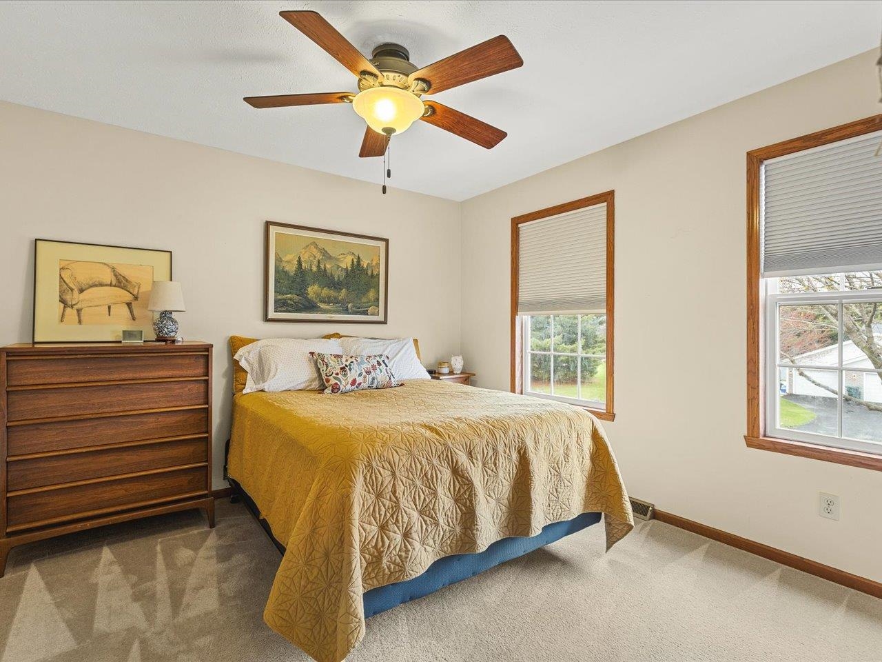 8027 Barclay Road Rockford, IL 61102 - Photo 36 of 67 a bed sitting in a bedroom next to a window