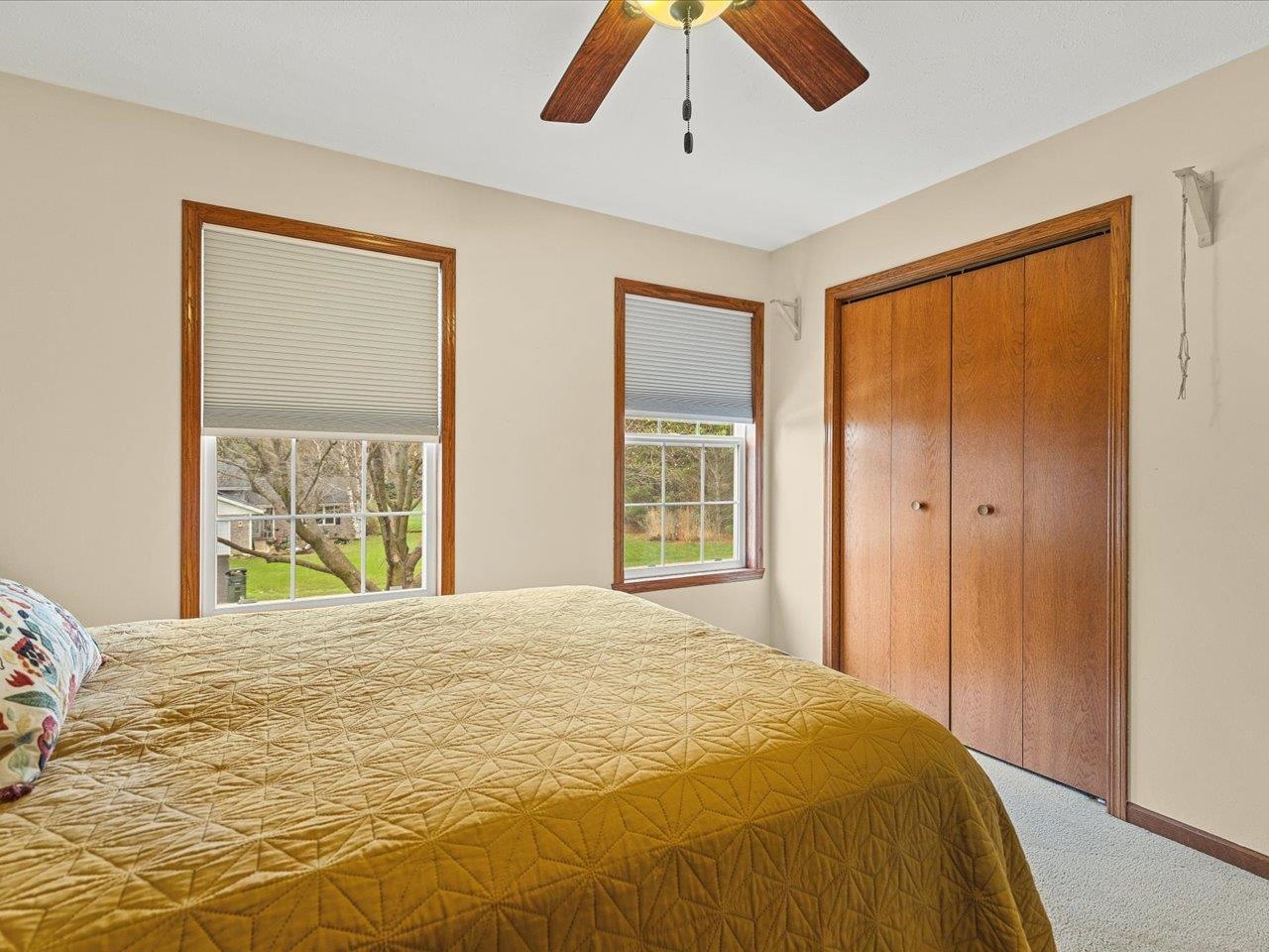 8027 Barclay Road Rockford, IL 61102 - Photo 37 of 67 a bedroom with a large bed and a window