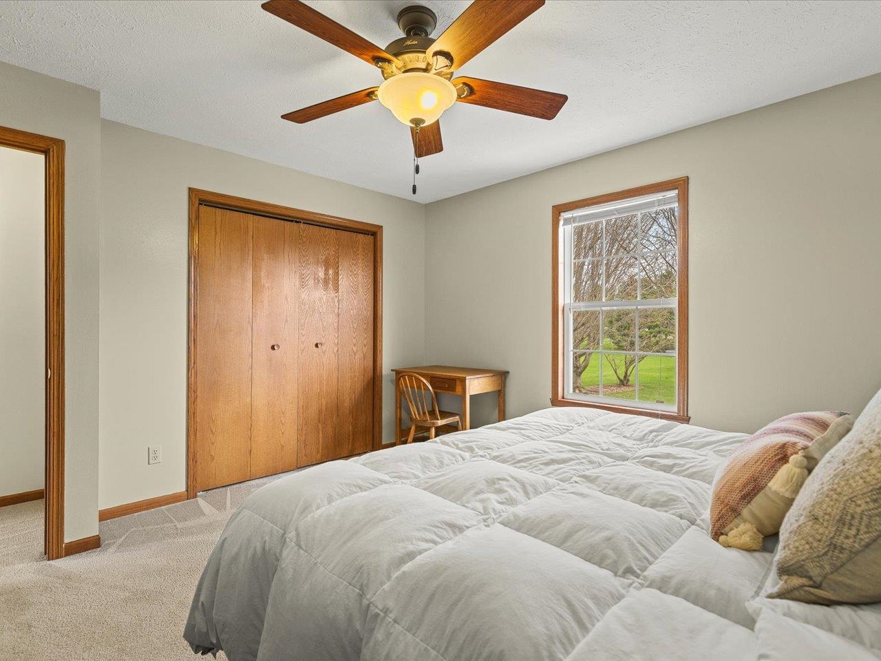 8027 Barclay Road Rockford, IL 61102 - Photo 40 of 67 a bedroom with a bed and a window