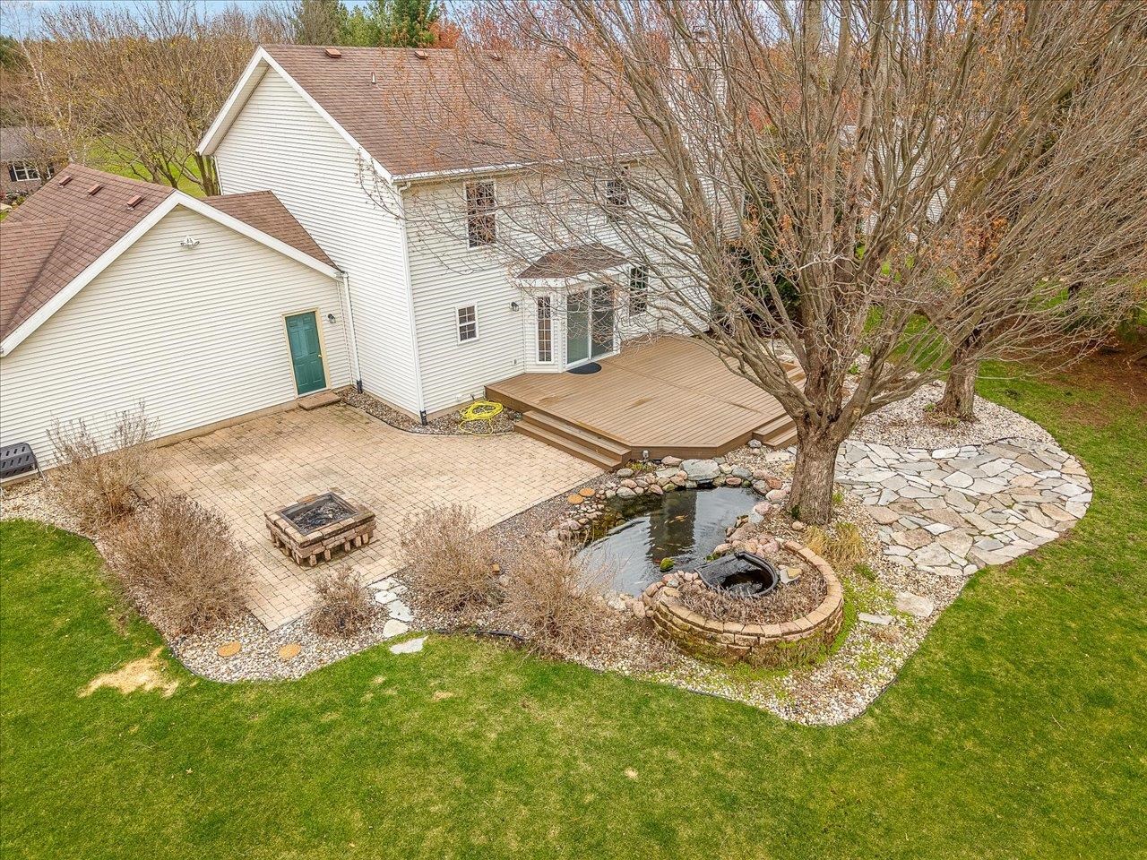 8027 Barclay Road Rockford, IL 61102 - Photo 56 of 67 a view of a backyard with table and chairs