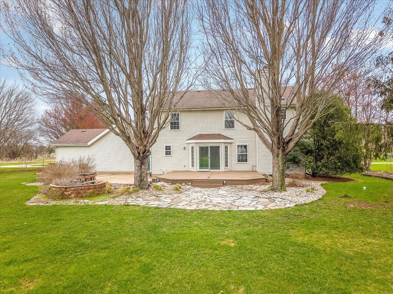 8027 Barclay Road Rockford, IL 61102 - Photo 57 of 67 a white house that has a tree in it