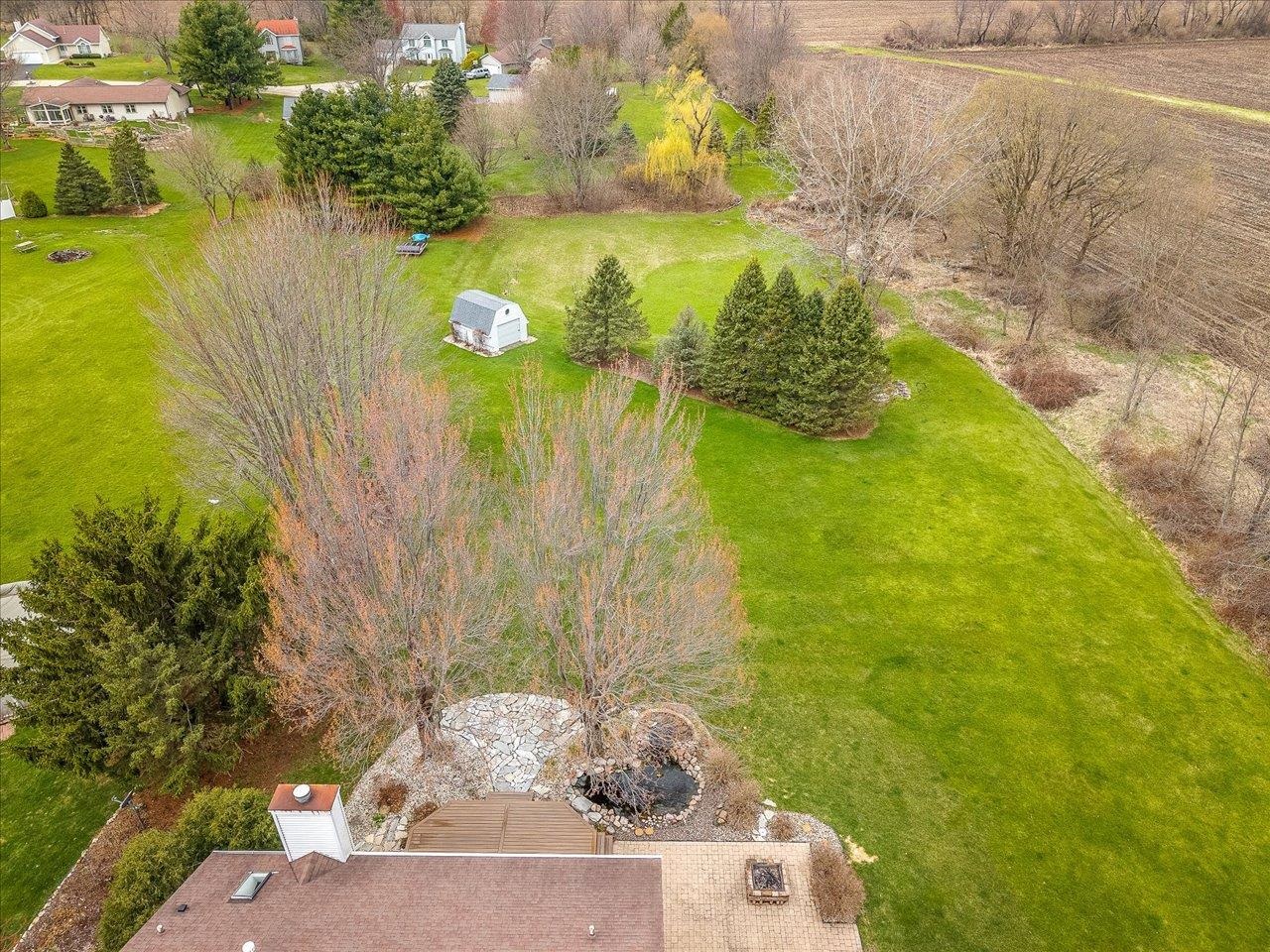 8027 Barclay Road Rockford, IL 61102 - Photo 66 of 67 a view of a lake with a big yard