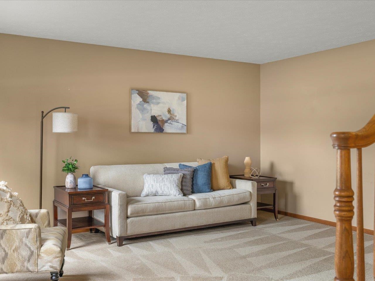 8027 Barclay Road Rockford, IL 61102 - Photo 7 of 67 a living room with furniture and a painting on the wall