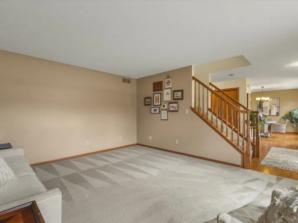 a view of an empty room with stairs