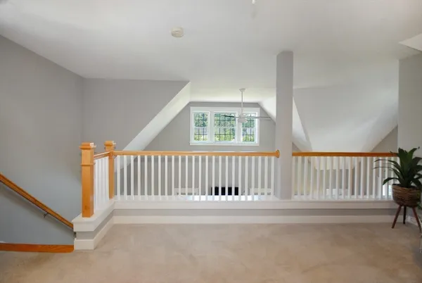a view of a porch with wooden floor and fence