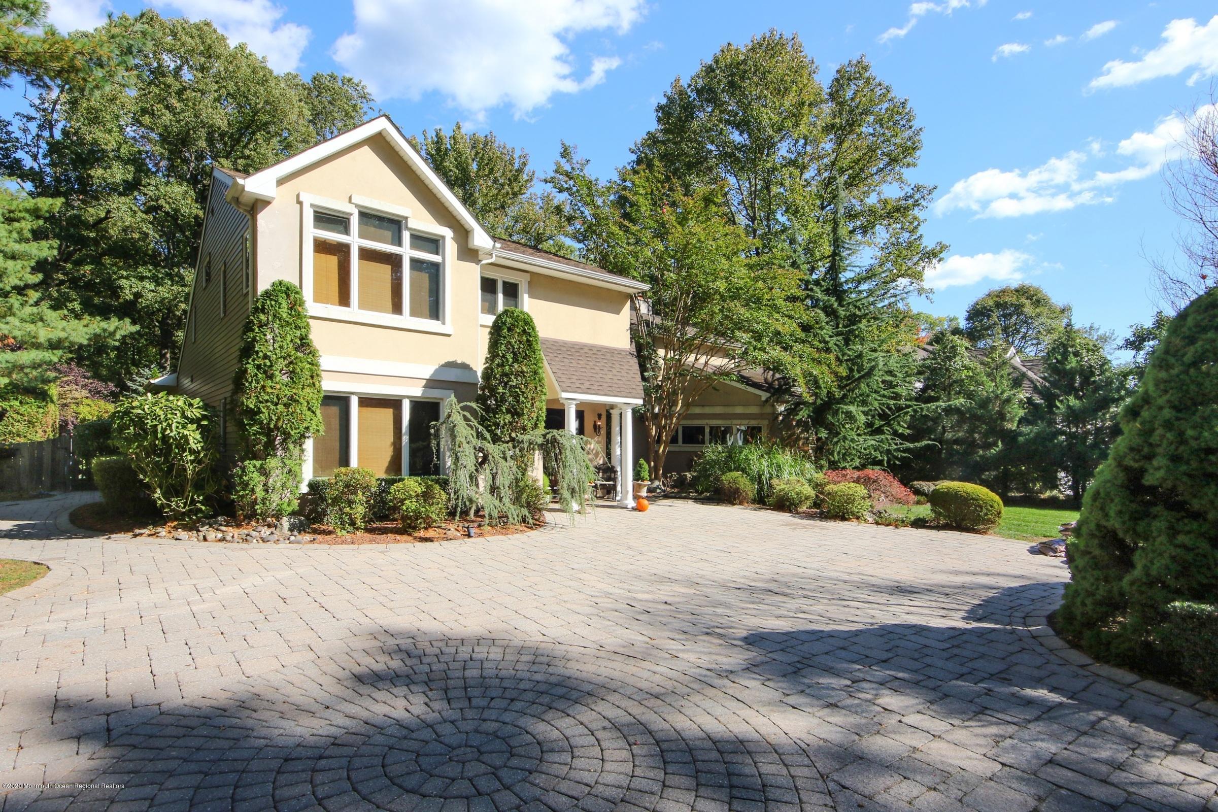 18 Daniel Drive Little Silver, NJ 07739 - Photo 2 of 55 a front view of a house with a yard