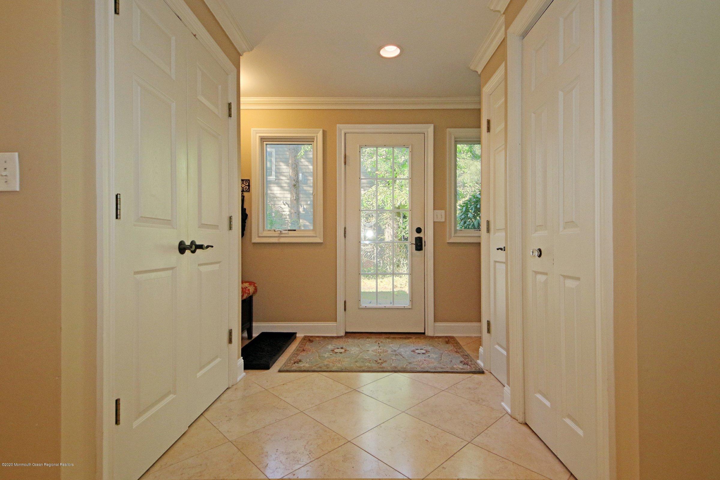 18 Daniel Drive Little Silver, NJ 07739 - Photo 13 of 55 a view of a hallway with wooden floor and a bathroom