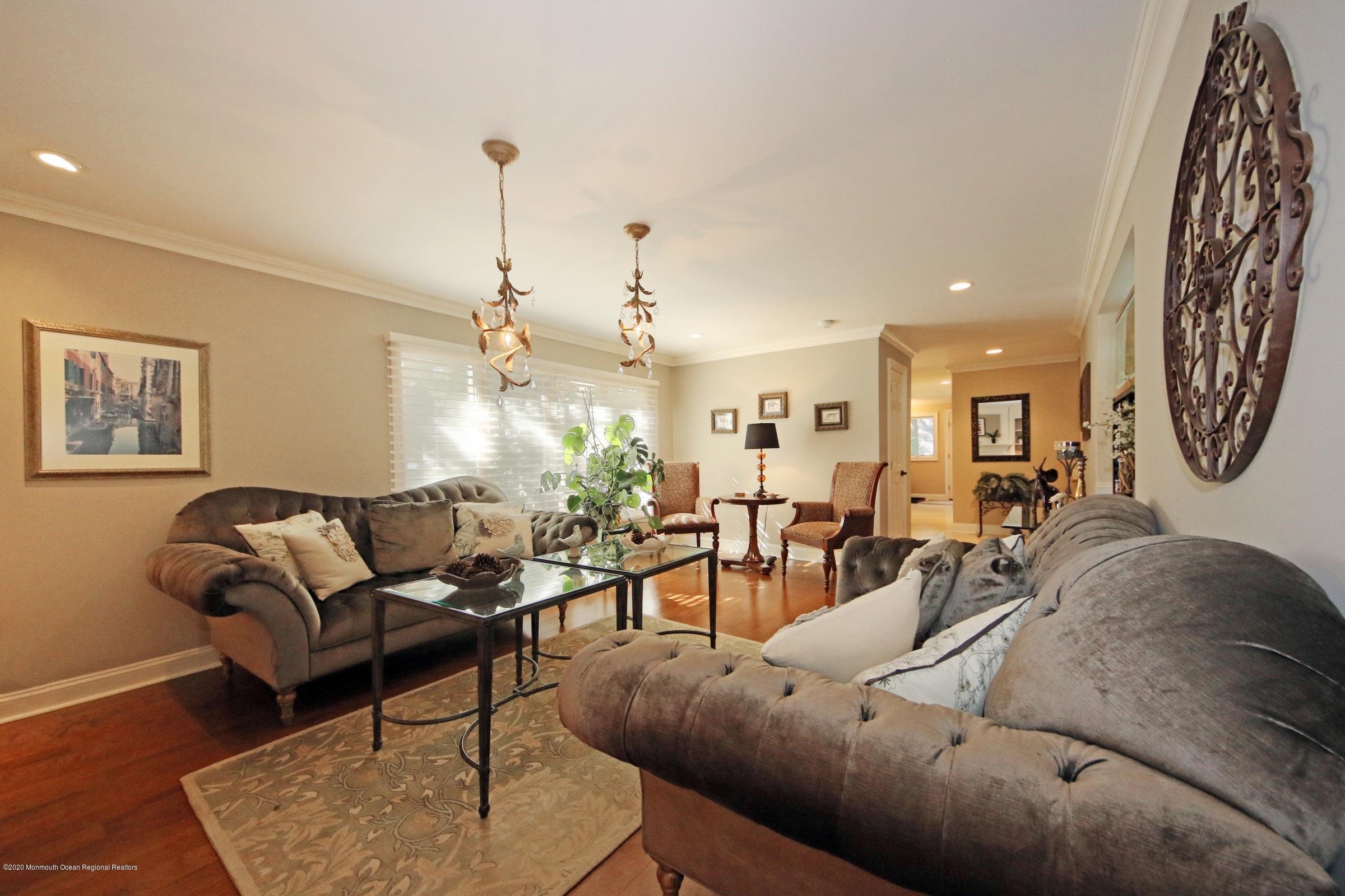 18 Daniel Drive Little Silver, NJ 07739 - Photo 15 of 55 a living room with furniture and a chandelier