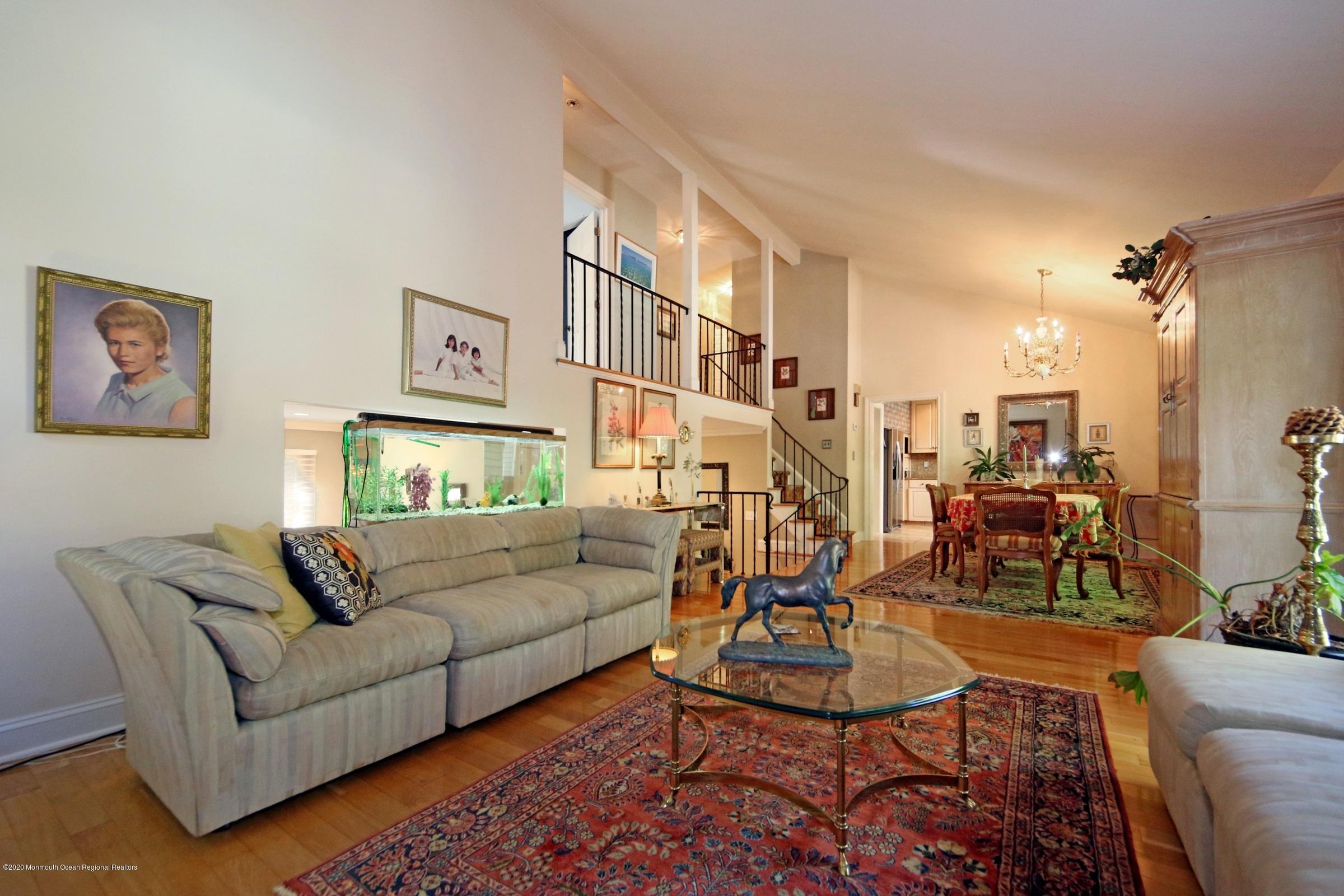18 Daniel Drive Little Silver, NJ 07739 - Photo 21 of 55 a living room with furniture a rug and a chandelier