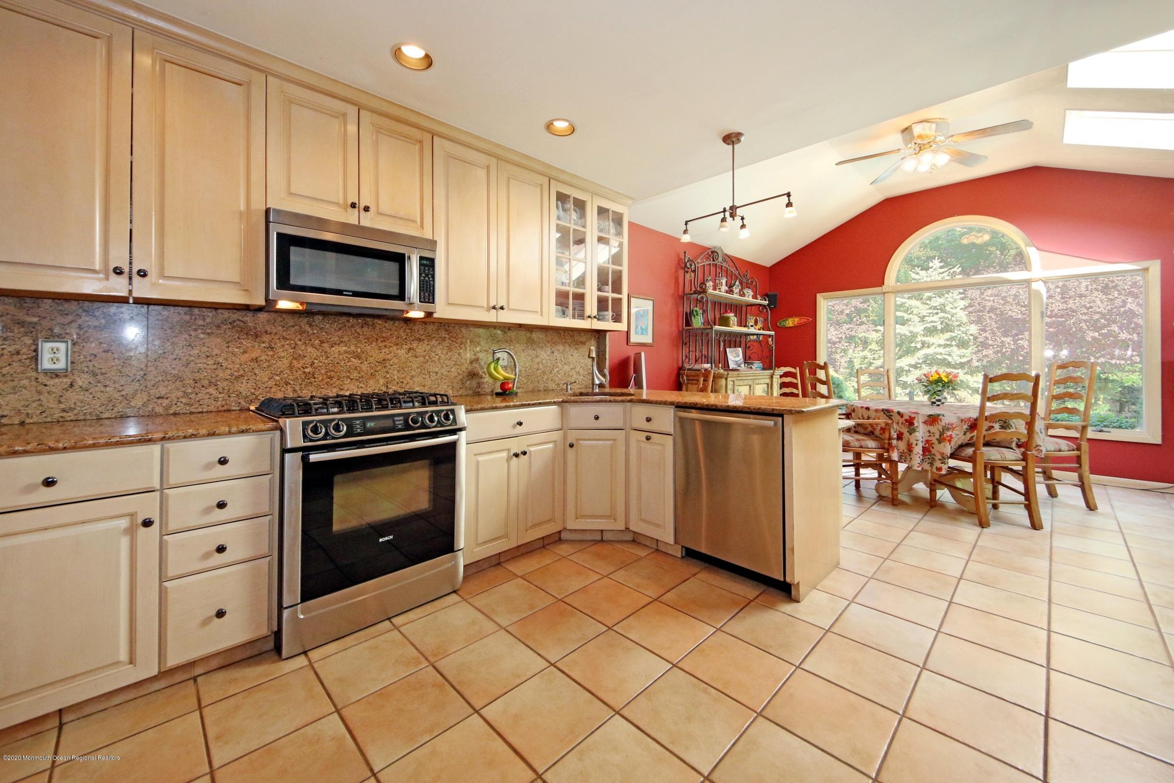 18 Daniel Drive Little Silver, NJ 07739 - Photo 24 of 55 a kitchen with stainless steel appliances granite countertop a stove and cabinets