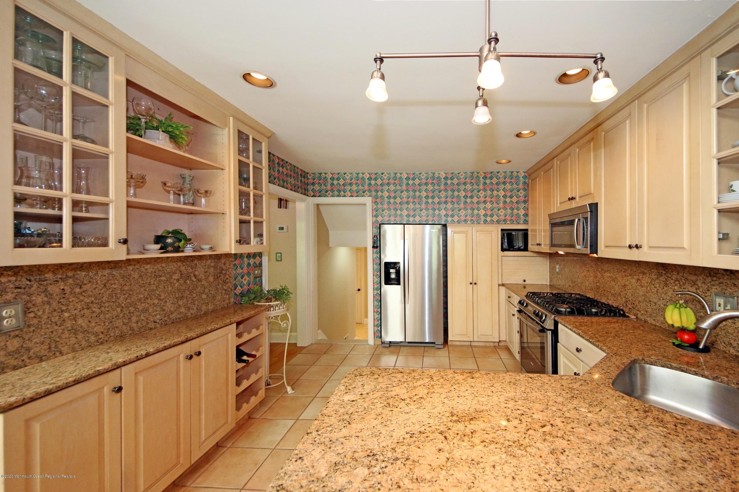 18 Daniel Drive Little Silver, NJ 07739 - Photo 26 of 55 a kitchen with stainless steel appliances granite countertop a sink and cabinets