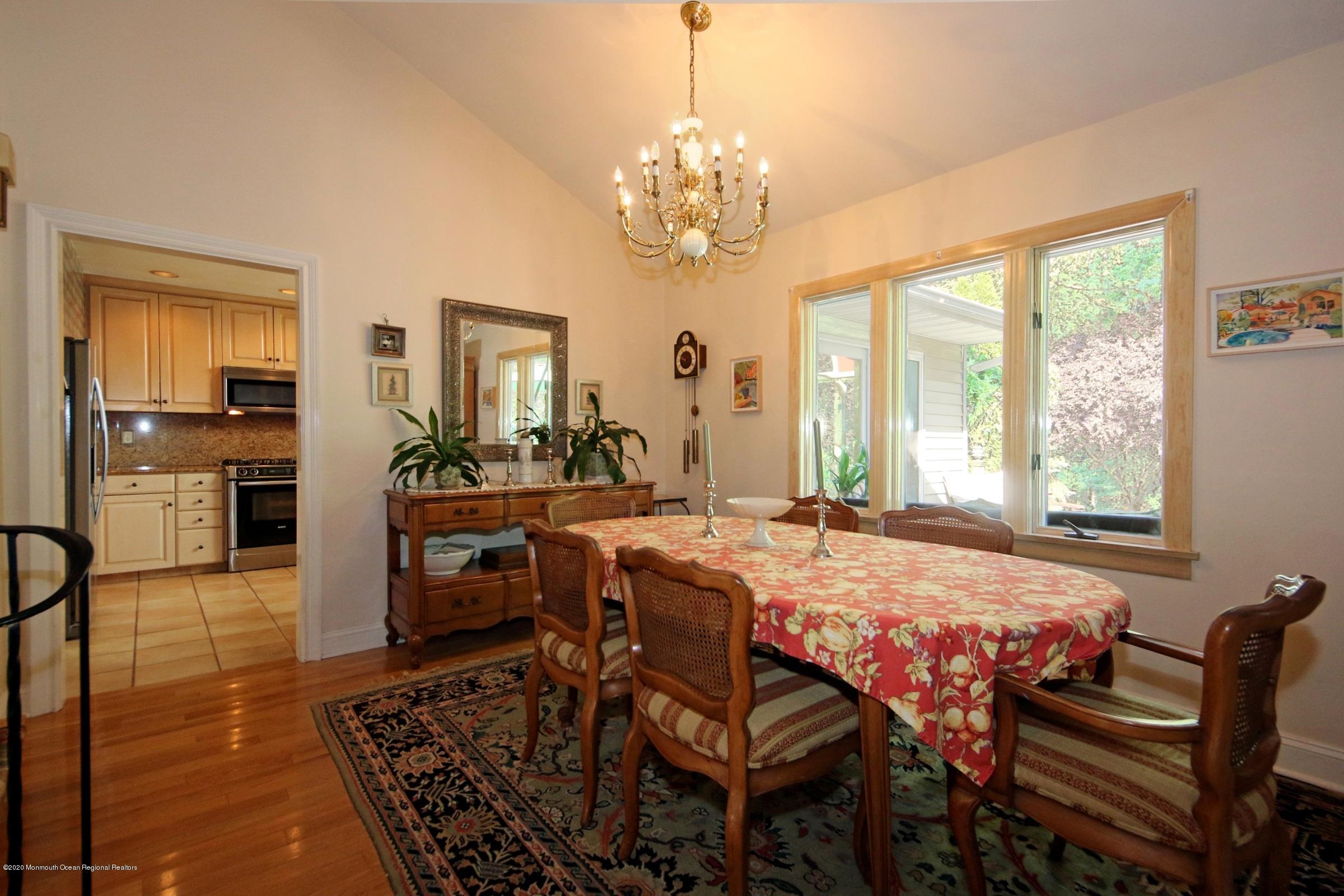 18 Daniel Drive Little Silver, NJ 07739 - Photo 28 of 55 a dining room with wooden floor and chandelier
