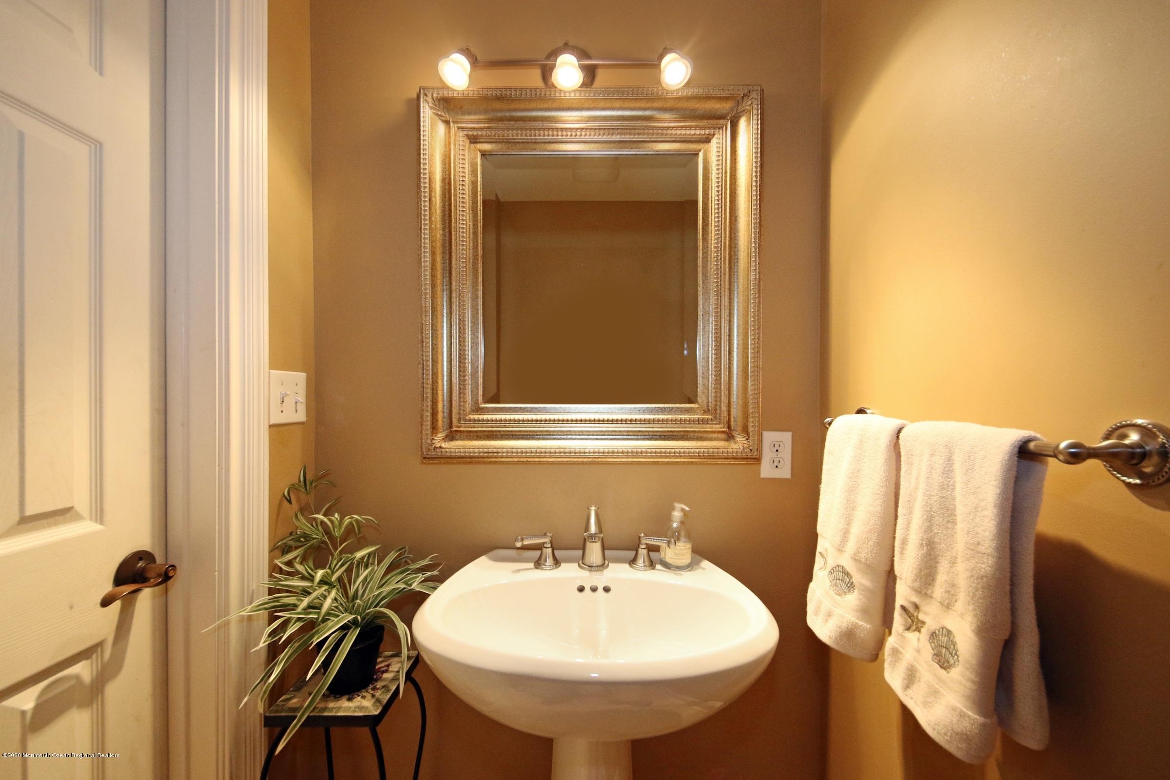 18 Daniel Drive Little Silver, NJ 07739 - Photo 32 of 55 a bathroom with a sink and a mirror