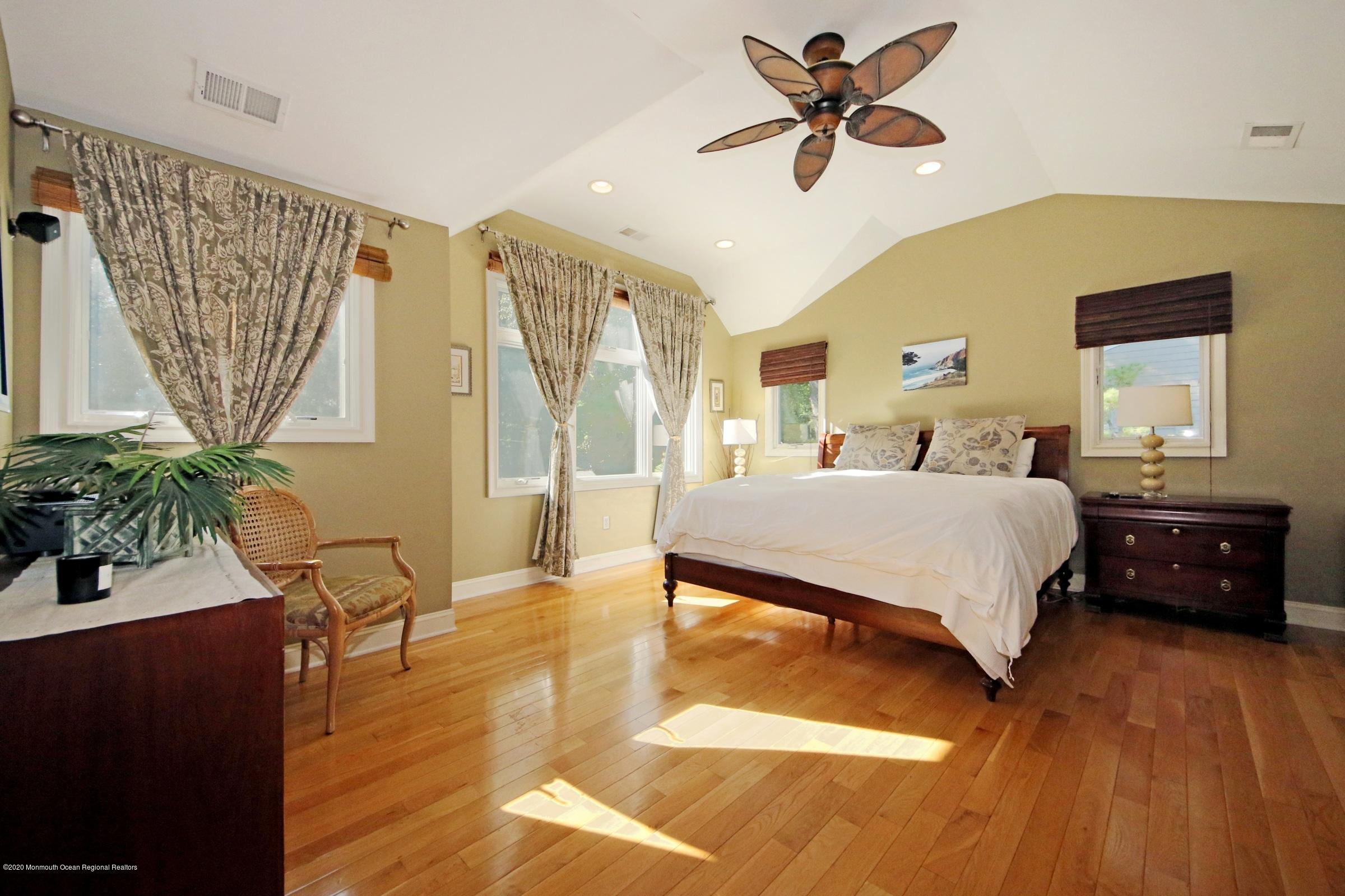 18 Daniel Drive Little Silver, NJ 07739 - Photo 33 of 55 a bedroom with a bed and wooden floor