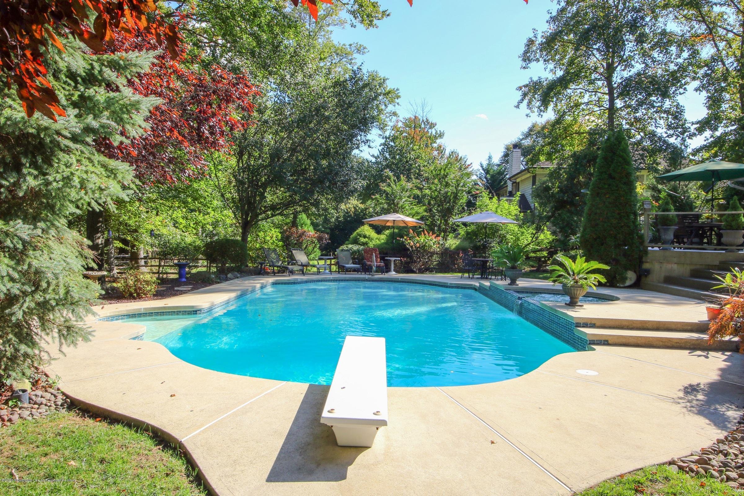 18 Daniel Drive Little Silver, NJ 07739 - Photo 41 of 55 a view of a swimming pool with a patio