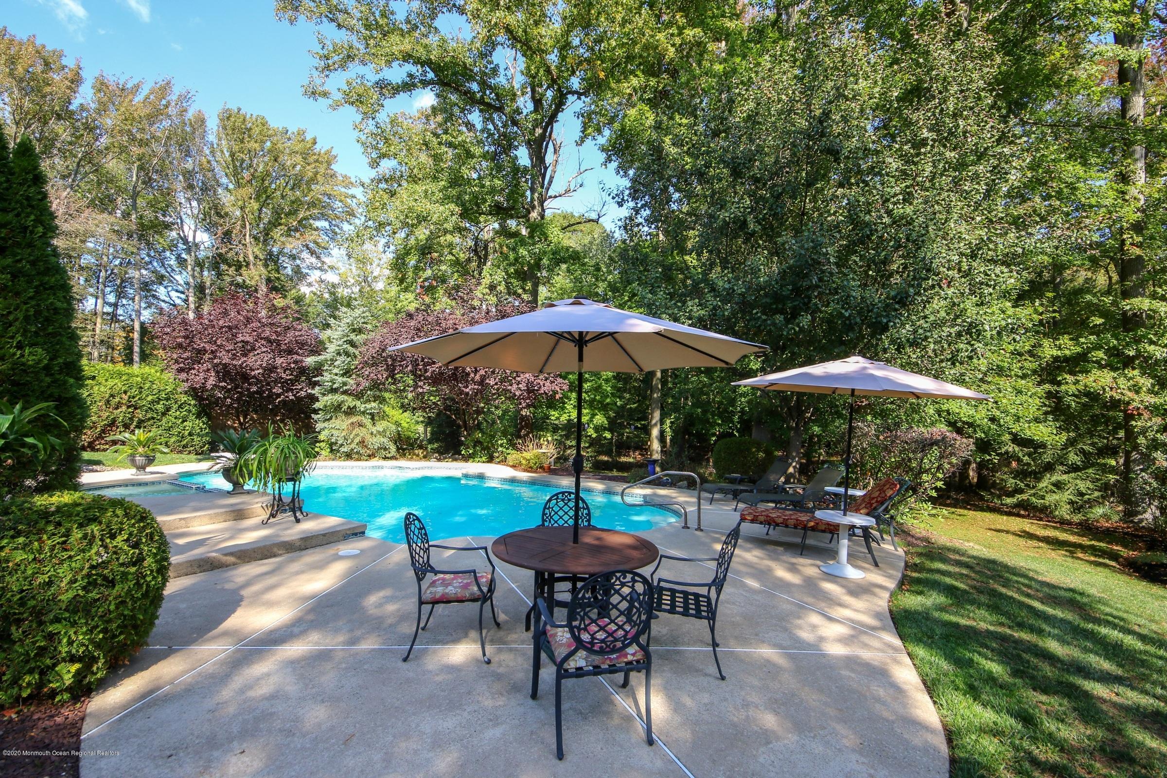 18 Daniel Drive Little Silver, NJ 07739 - Photo 46 of 55 a swimming pool with outdoor seating yard and barbeque oven