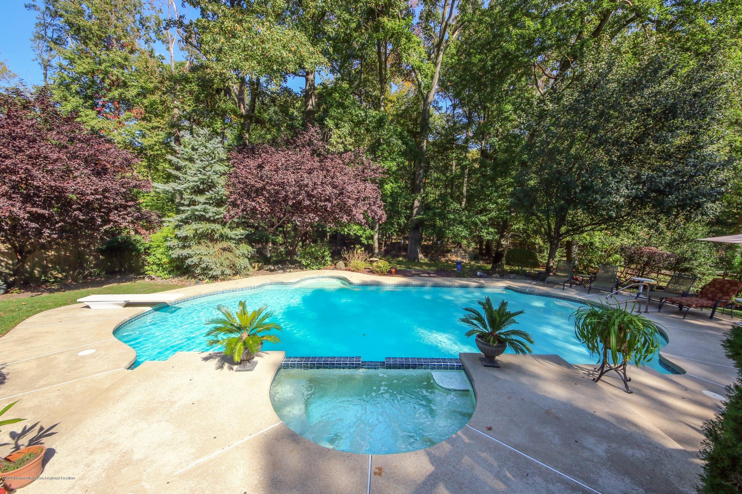 18 Daniel Drive Little Silver, NJ 07739 - Photo 47 of 55 a view of a swimming pool with a patio